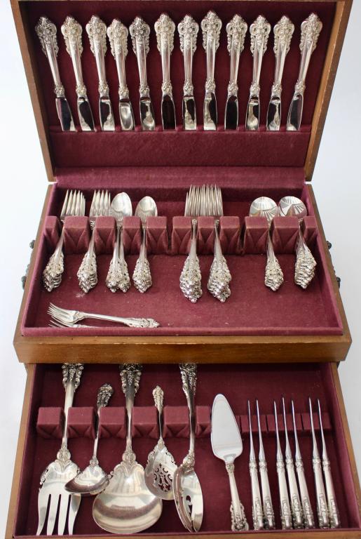 Wallace Grande Baroque Sterling Flatware: service for 12 plus extras; 12-7.5" DF, 12-6.5" SF, 12-9" DF, 11-6.5" TS, 4 cocktail forks, 12-CS, 7-BK, 1 cheese knife, 1 large SS, 1 large MSF, 2 slotted spoons, 1 ladle. 76 pieces total, 99 ozt.