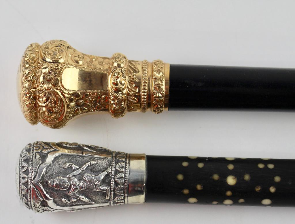 Two Gentleman: one with large gold knob, marked Simon Brothers Co., presented to "Byron H. Horne, 1949, Rochester Trust Company". Ebonized hardwood with brass tip, 36" and a 34" example with sterling top and circula