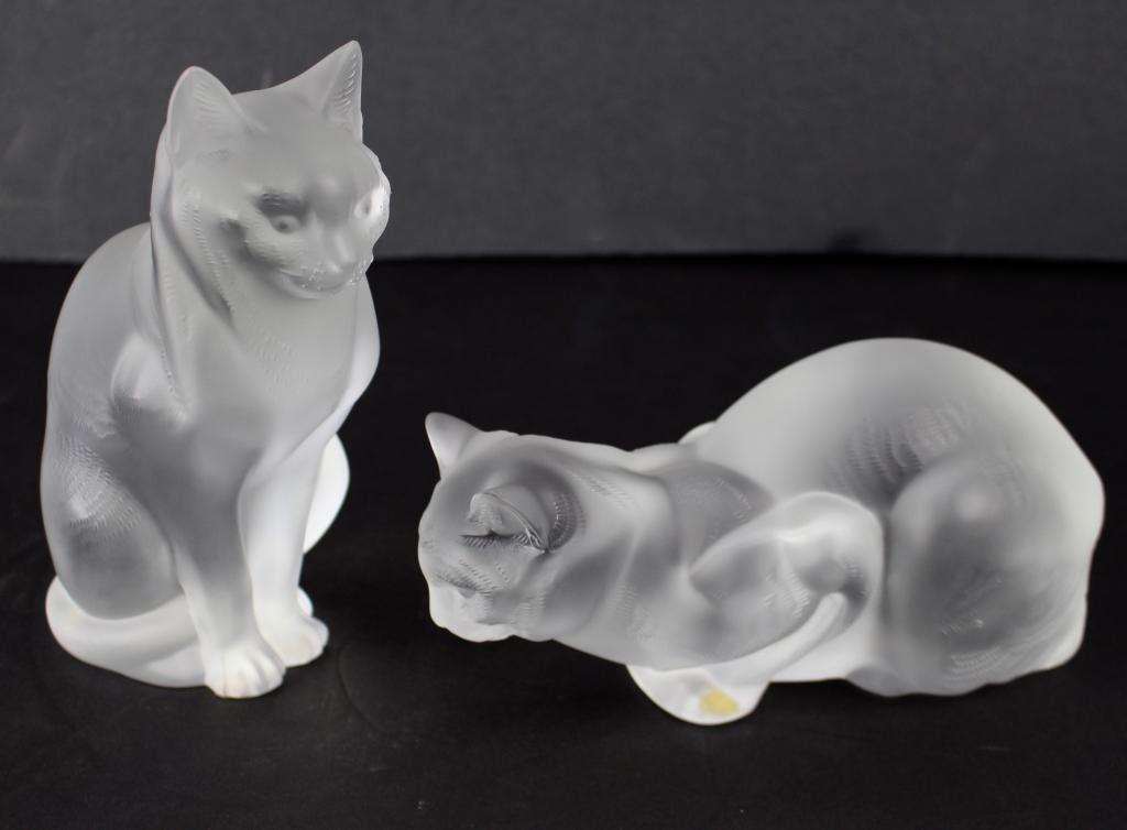 Two Lalique Figural Cats: one sitting up, one reclining, etched signatures, original boxes, mint condition.