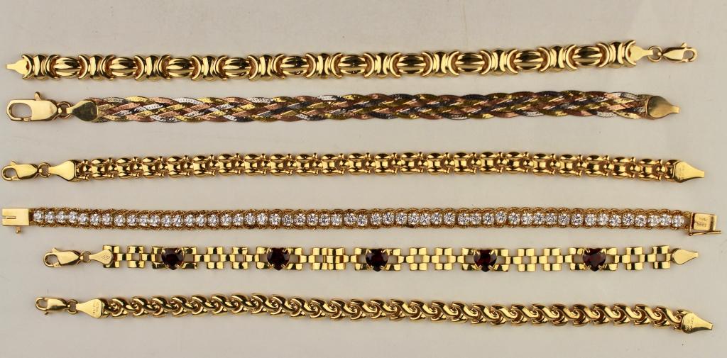 Group of Six - 18K & 14K Gold Bracelets: link style, one set with CZs, one with heart shape garnets, 18K-7.2 dwt, 14K-18.8dwt.