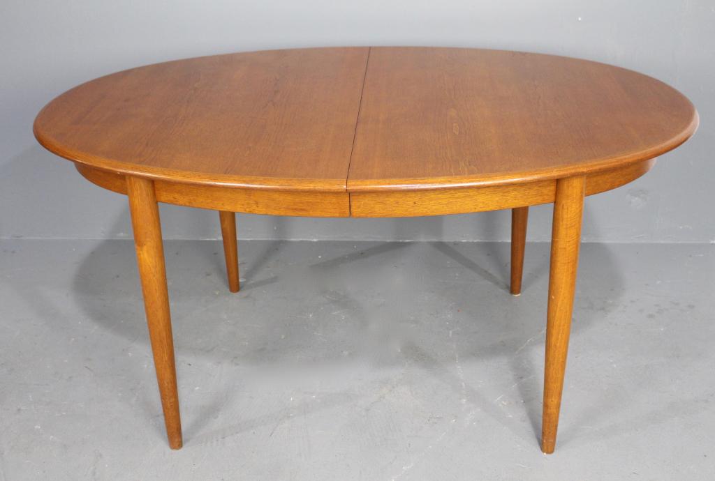 Danish Teak Mid-Century Dining Table: Gudme Mobel Fabrik, Denmark stenciled on bottom, 29" x 59" x 40" wide, with 2 large 19" leaves, very good condition, purchased by consignor in Fairbanks, Alaska, 1965.