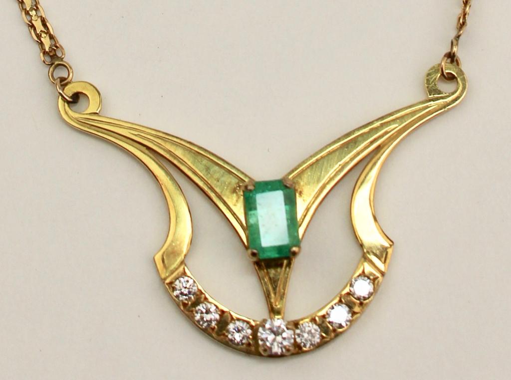 Emerald & Diamond Necklace: set in 18K yellow gold with 14K gold chain (attached). Emerald 1.5ct. VSIbG, tone 4, sat 4, I1-I-2. 7 diamonds H color. 10.8 grams total weight. 18.75" long, pendant 1.75 x 1.25".