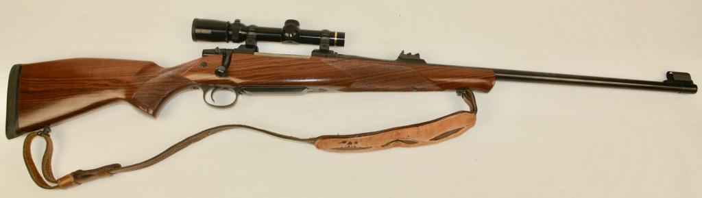 CZ Model 550 Safari Magnum Rifle: .416 Rigby, Leupold 1.5-5 variable, internal 3 plus 1 magazine, beautiful walnut stock, recoil pad, 24" barrel rear leaf sight and front globe sight, leather sling, excellent condition. Serial #80506.