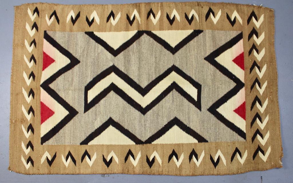 Southwest Native American Crystal Rug: (Navajo) c. 1920-30, Ganado style, tan, light brown, black outlines, red triangles (minor bleeding), typical wear and slight imperfections consistent with age, 57" x 48".