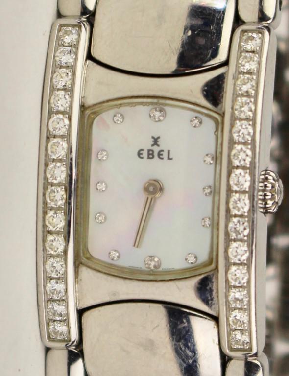Ebel Lady's Beluga Manchette Watch: stainless steel band with 14 diamonds on each side of case, #9057A28-10, white mother of pearl dial with diamond hour markers, Swiss made quartz movement, 8" band.
