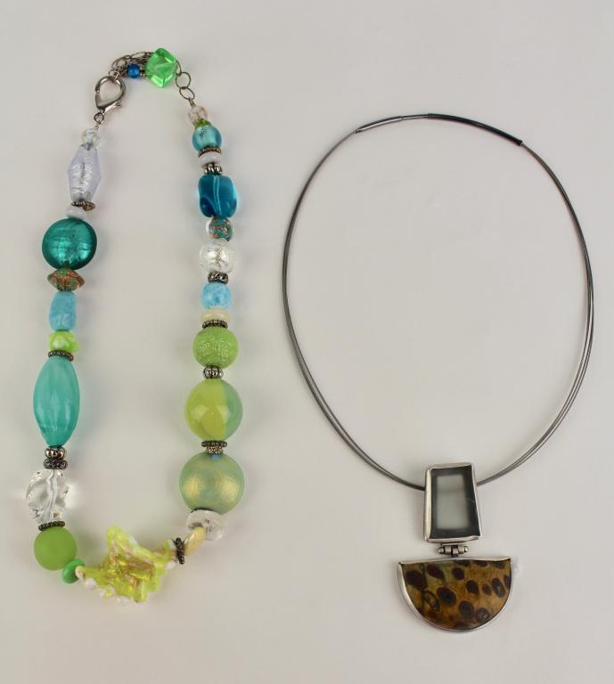 Two Modernist Necklaces: Ed Levin (att) sterling 18" pendant of burled agate and opaque glass, signed illegibly en verso, with a Venetian beaded glass necklace, 19" long, from National Gallery of Art, both with original sales