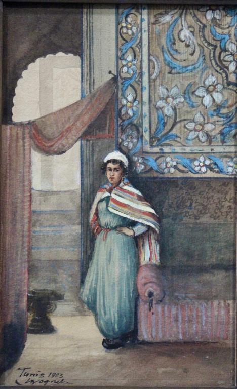 Louise Mathilde Auguste Wagner, W/C: 1875-1950, German, watercolor, "Tunis, 1903", depicting young girl standing by doorway, divan, Oriental rug hanging, signed lower left, original Arts & Crafts frame 15.25" x 19.75", image 7.5" x 11.5"