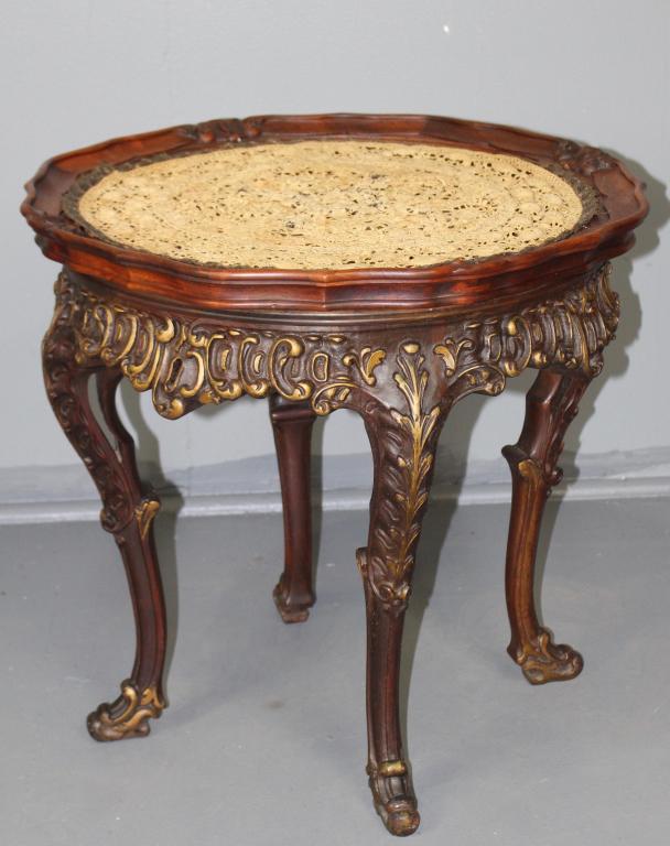 Mahogany Tea Table, c. 1920s: carved all over with lift top glass tray, French cabriole legs and deep apron, center hole in table exposing a spot for a gold anodized spun aluminum bowl also features an nice tatted round, which fit