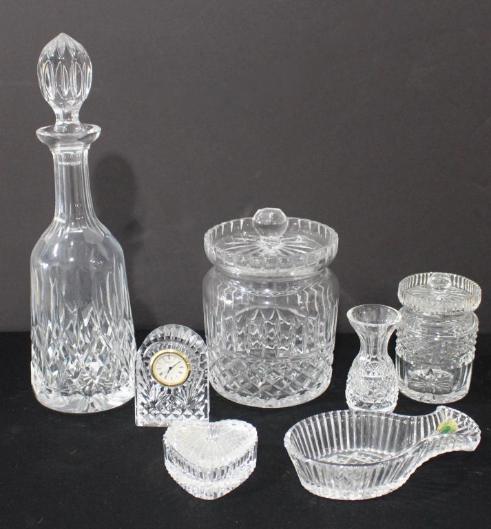 Waterford Crystal Group (7): Lismore decanter, biscuit jar, mustard jar, small quartz clock, heart shaped box, small bud vase, elegant spoon rest, all good condition.
