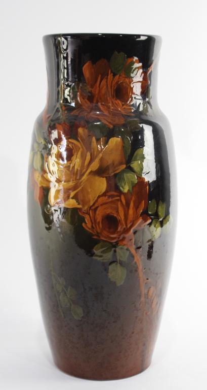 Fine Owens Pottery Utopian Vase: standard glaze, slip decorated with yellow roses and thorny stems, artist signed by Charles W. Chilote, c. 1900, impressed marks on bottom, very minor crazing, a tiny 1/8" chip on base, a fine example