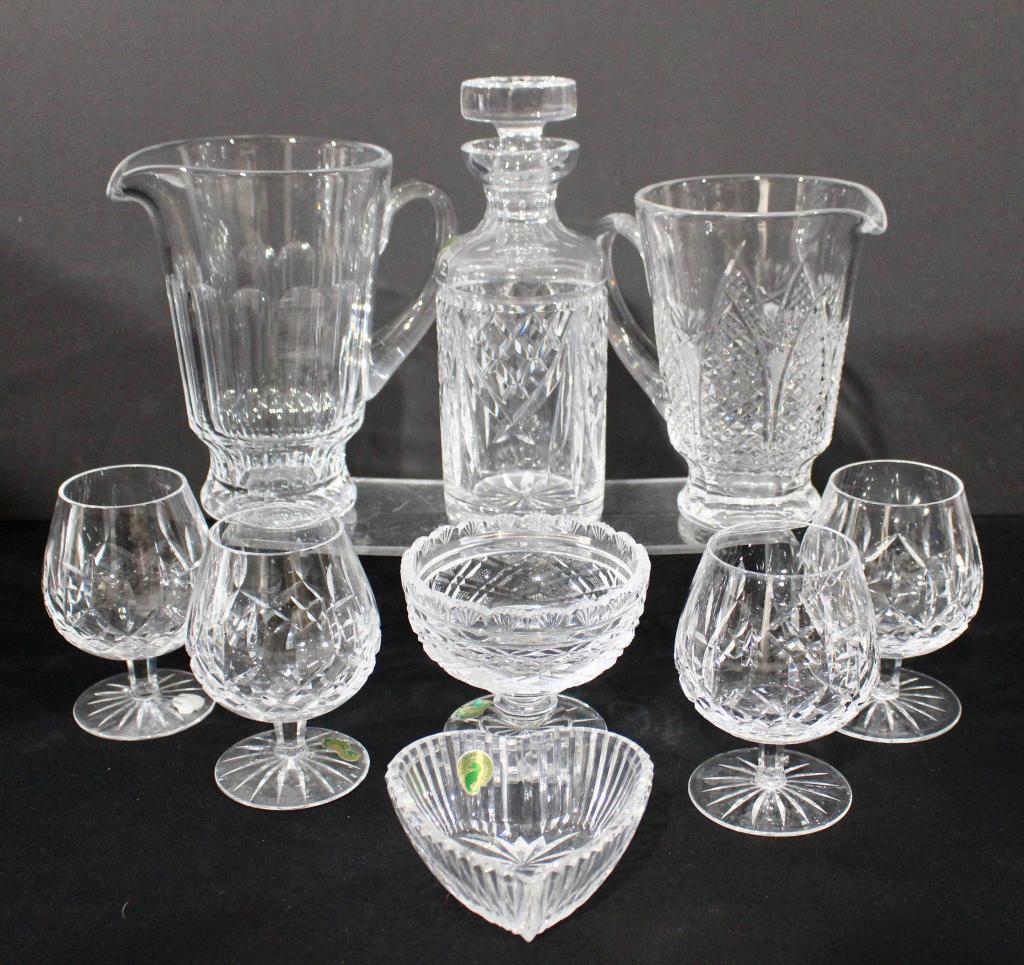 Waterford Crystal Grouping (9): Lismore 4-5.5" brandy snifters, 1-4.5" x 5" footed bowl, two pitchers 7." and 8", decanter and stopper with original box, heart shaped bowl with box, all signed, good condition.