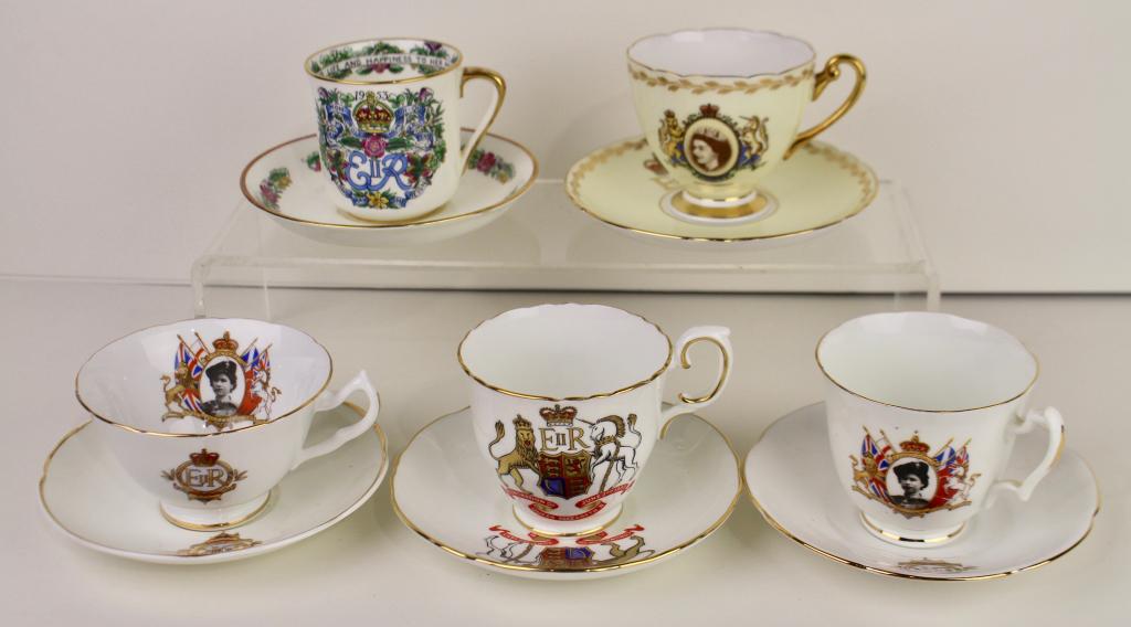 British Royal Queen Elizabeth II Objects: an 8" bracelet with 3 medallion charms of the 1953 Coronation, cups and saucers by Hammersly, Crown Staffordshire and Shelley either with Coat of Arms and/or portrait. One saucer with spider in bottom