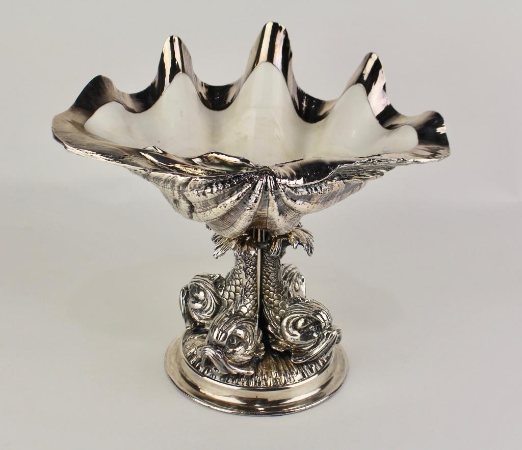 Rare Silver Coated Seashell: exclusive to Ruzzetti & Gow, seashell on quad dolphin base, c. 1997, this being "Triton Cellini" one of a kind, hand made in Rome. Shell rests on post in dolphin base, 11" x 12" extraordinary.