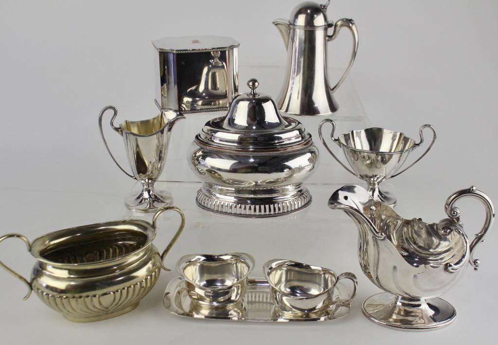Silver Plate Grouping: footed nautilus shell gravy boat, Pairpoint cream and sugar, English tea caddy, lidded syrup pitcher, Sheffield EPNS ribbed and handled waste bowl, unsigned master sugar with lid, Cohr Denmark "Atla" 