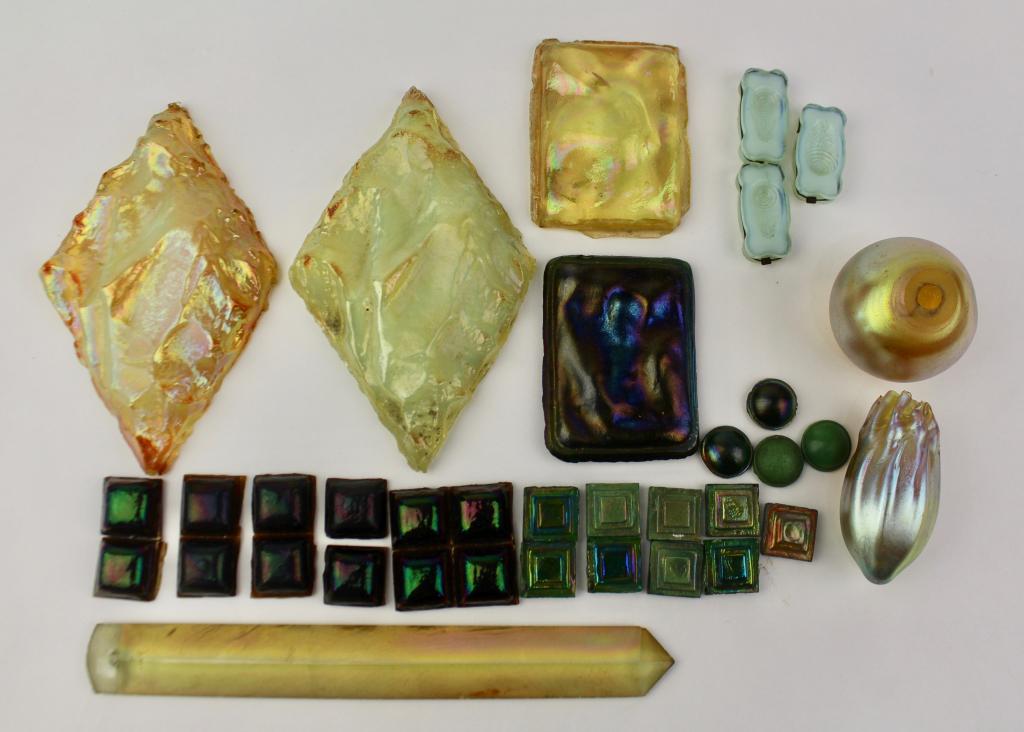 Group Tiffany Studios Glass Tiles and Parts: consisting of two rectangle tiles 2.25" x 3", two diamond shape tiles 5", 4 cabochons, prism 8", 24 small tiles, 2 unidentified iridescent parts, none signed. From estate of Joe Briggs' son, c. 1965.