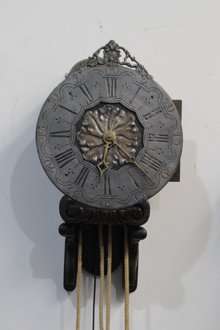 Early English Lantern Wall Clock: mid 19th century, dated 1860, lead face, weight driven time (weight included), 10" x 15" tall x 7" deep, 39" pendulum, running and chiming, good condition.