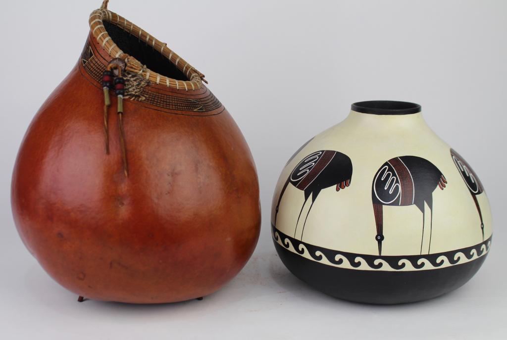 Two Gourd Art, by Rivera and Gibson: Ron Rivera, Ocate, NM, decorated gourd "Mimbres Cranes", signed and dated 1990, 8" x 10". A large 11" x 10" neck decorated vessel with leather, beads and pine needle rim, carved and scored decoration 