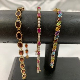 (3) 14K Gold Tennis Bracelets -Ruby, Diamond-23.7 Grams: (3) 14 K Gold Tennis Bracelets- Ruby, Diamonds and Multi colored Gemstones 23.7 Grams total weight. Excellent condition.