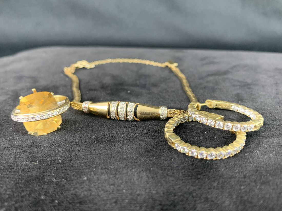 14 K Yellow Gold Bracelet, Ring & Earring Set: 14 K Yellow Gold Bracelet, Ring & Earring Set. Total weight is 17.2. Earrings are hoop with diamonds, ring has amber stone with diamonds and is a size 7. The bracelet has a chain clasp and has diamond