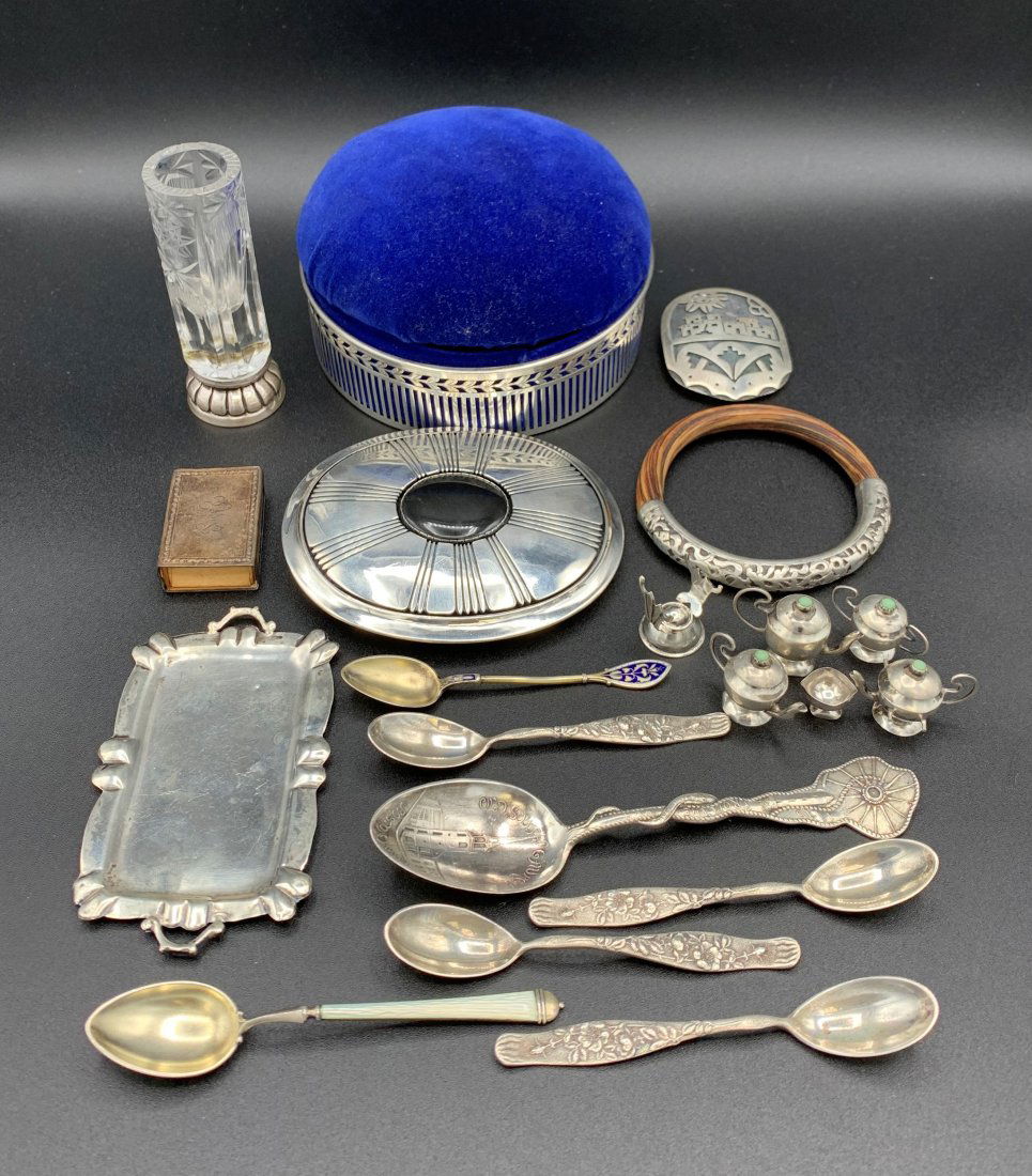 Lot Sterling Silver - Bracelet, Buckle, Spoons 12.5 OZT: Lot Sterling Silver - Bracelet, Buckle, Spoons 12.5 Troy Oz. Sewing box/pin cushion is 5" in diameter and 3" tall. Belt buckle is 4 1/2" x 3 1/2". Bracelet is 3" in diameter. 7 Misc. spoons, largest i