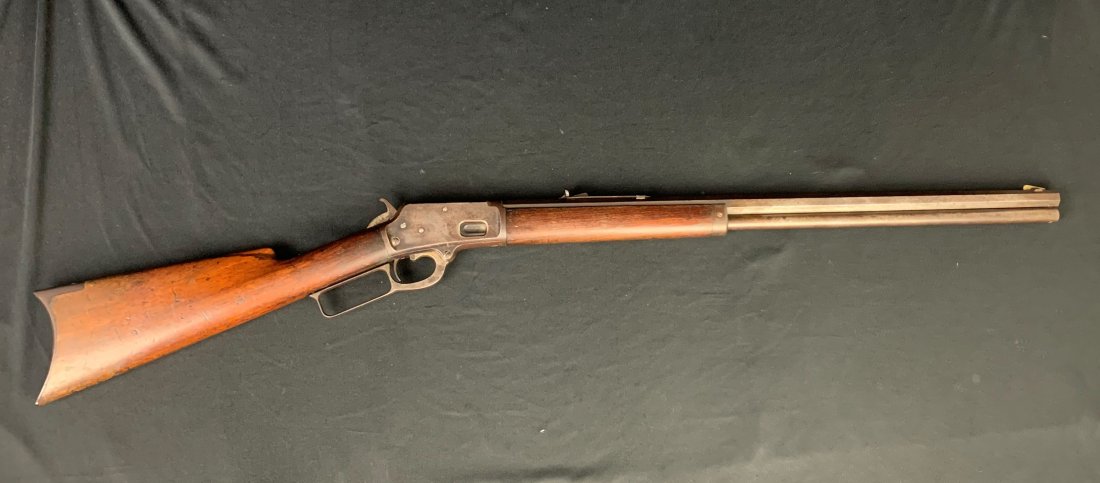Marlin Model 1889 Lever Action Rifle .38-40 Caliber: Marlin Model 1889 Lever Action Rifle .38-40 Caliber. Serial number 24344. Marlin Firearms Co. New Haven CT. Original patented October 11, 1887. Barrel length 23". Entire gun measures 41". Overall good