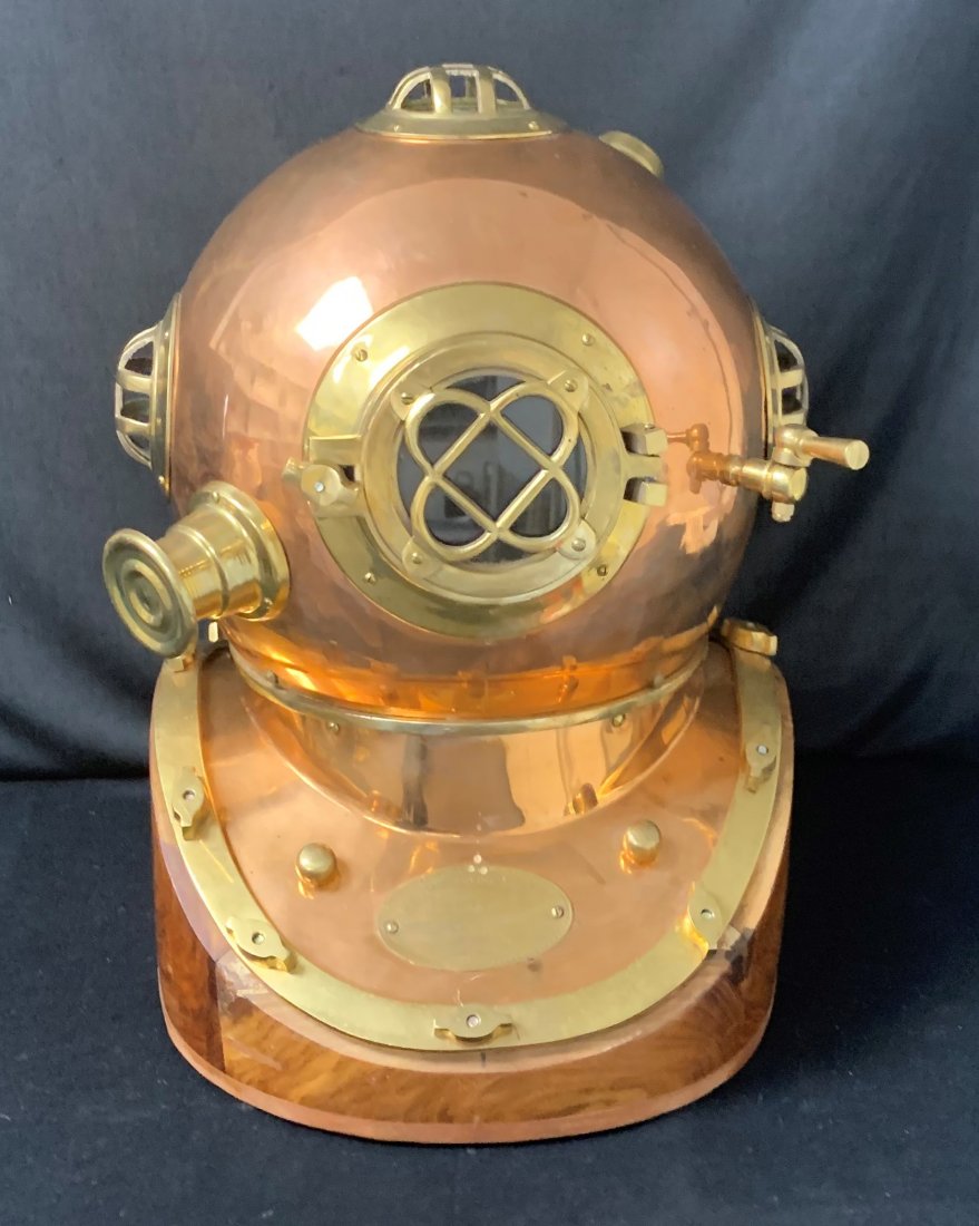 U.S. Navy Copper Diving Helmet - Mark V: U.S. Navy Copper Diving Helmet - Mark V brass fitted. Mounted on a wood base. 19" x 14" x 16" neck diameter is 9" and weighs 19.5 lbs. Morse Diving Equipment Co. Inc. Boston MA, No. 5255 dated 1941. O