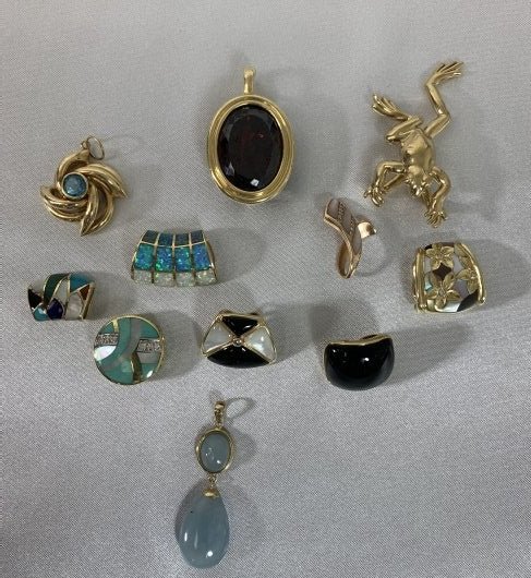 Lot of (11) 14K Gold & Gemstones Asch Grossbardt Garnet: Lot of (11) 14K Gold & Gemstone Asch Grossbardt Garnet. The large slide is garnet. Two Asch Grossbardt slides. Total weight 63.1 grams. Good condition.