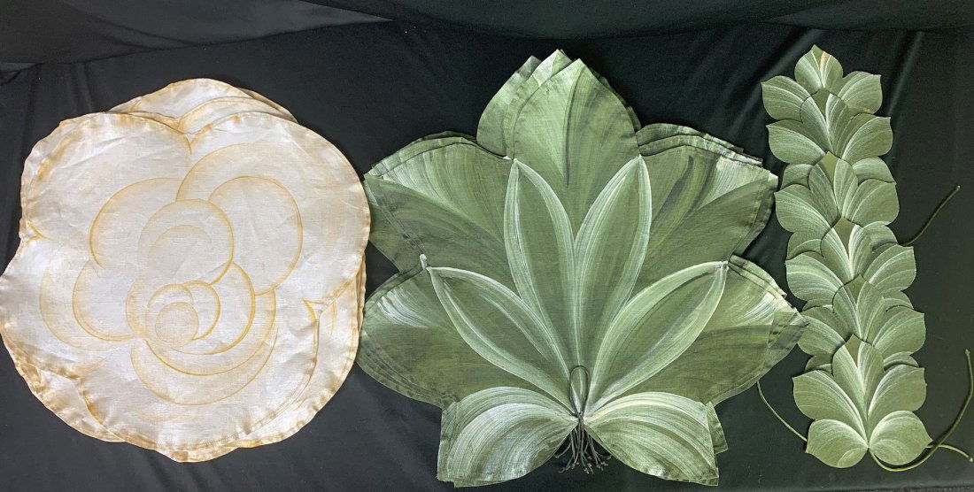 Lot of Carole Shiber Hand Painted Placemats: Lot of Carole Shiber Hand Painted Placemats. 6 Large leaf placemats with 6 matching coasters. Mats measure 20" x 20" coasters are 6" x 6". 6 flower placemats that measure 17" x 17". Very good conditio