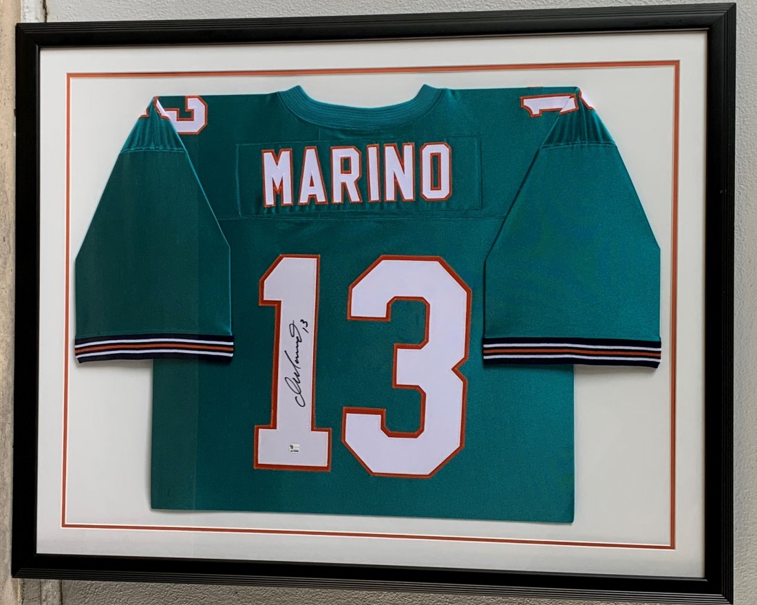 Miami Dolphins Dan Marino Autographed Jersey #13: Miami Dolphins Dan Marino Autographed Jersey #13. Framed and matted, measuring 32" x 40.5". Certified authentic. Perfect condition.