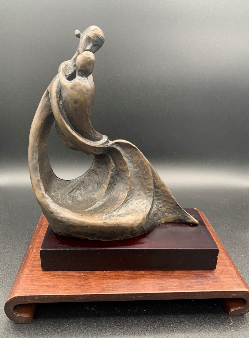 Korean Bronze Sculpture "Mother & Child" on Wood Base: Korean Bronze "Mother & Child" on Wood Base. Comes with a wood stand. The bronze measures 9" tall, 7" wide and 4" deep. Overall condition is good.