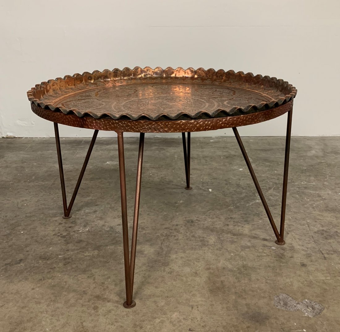 Middle Eastern Hammered Copper Tray Table: Middle Eastern Hammered Copper Tray Table. Tray sits on metal base. Very sturdy. It measures 30" x 19". Overall condition is good.