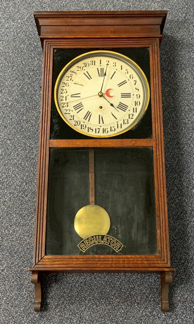Antique Sessions Oak Regulator Wall Clock: Antique Sessions Oak Regulator Wall Clock. The clock comes in a oak case that opens in the front. It comes with a key for setting and winding. It measures 39" x 16" x 5". Overall condition is good.