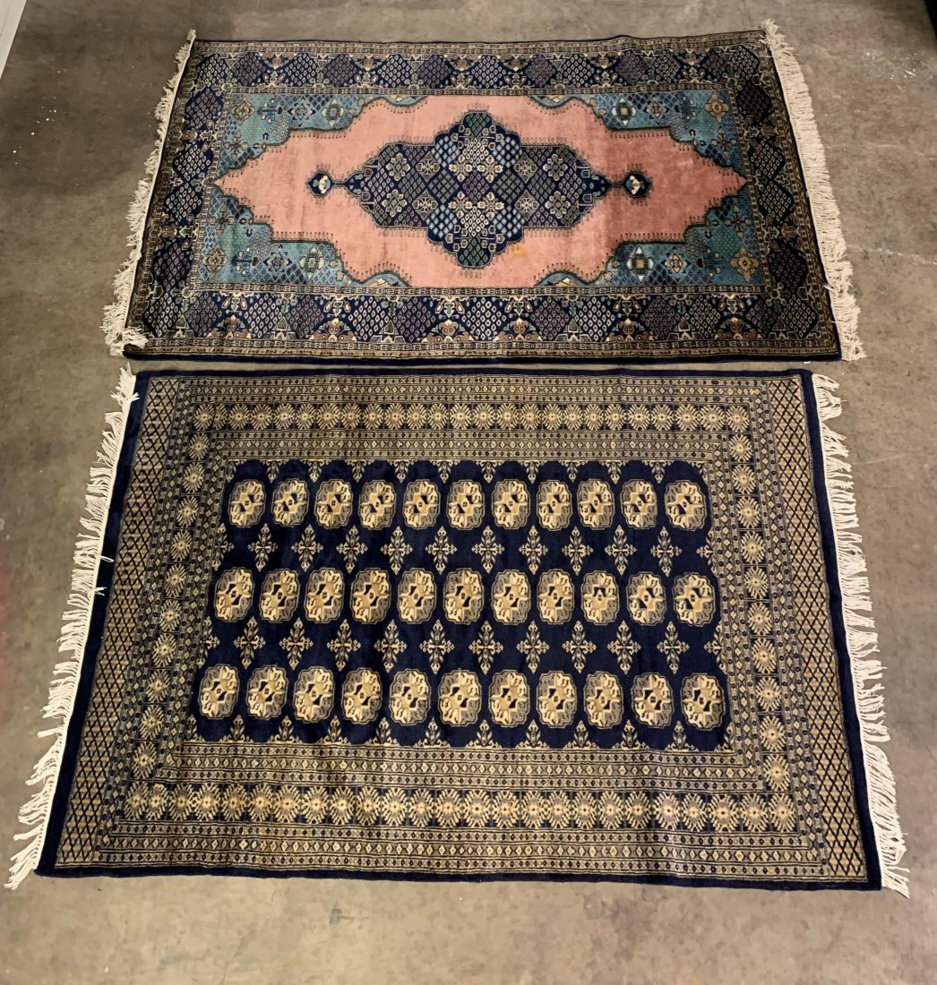 2 Handmade Wool Area Rugs: 2 Handmade Wool Area Rugs. First we have a royal blue, gold and pink rug. Measures L- 84" X W- 50". Second rug is royal blue and gold. Measures L- 78" X W- 50". Overall in good condition.