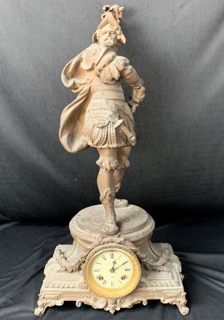 Antique Ansonia Spelter Conquistador Clock: Antique Ansonia Spelter Conquistador Clock. The statue measures 28" tall, 13" wide and 9" deep". The front sword is broken off, see photos. The weight is 27 lbs. Overall condition is good.