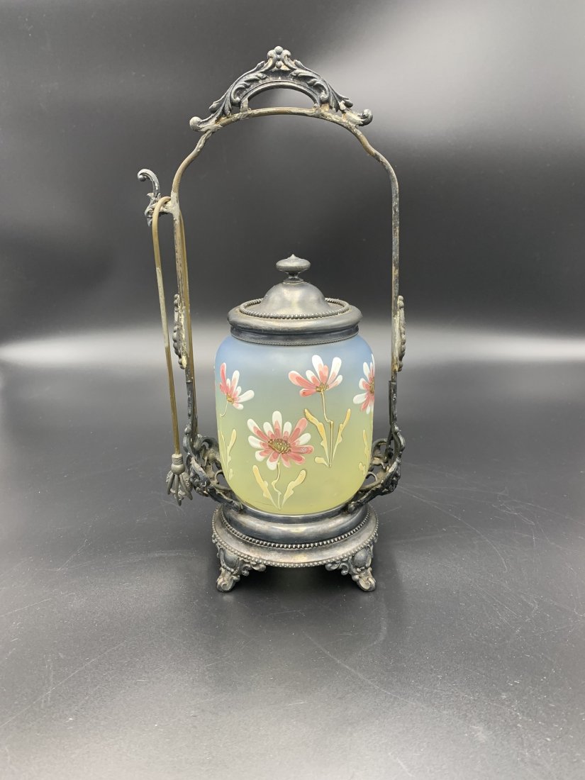 Homan Silver-Plate Victorian Pickle Caster: Homan Silver-Plate Co. Victorian Pickle Caster. Homan Silver-plate pickle castor, tongs and hand painted flowers on glass jar. Castor measures H- 11" x W- 5", glass jar measures H- 6" & tongs measures
