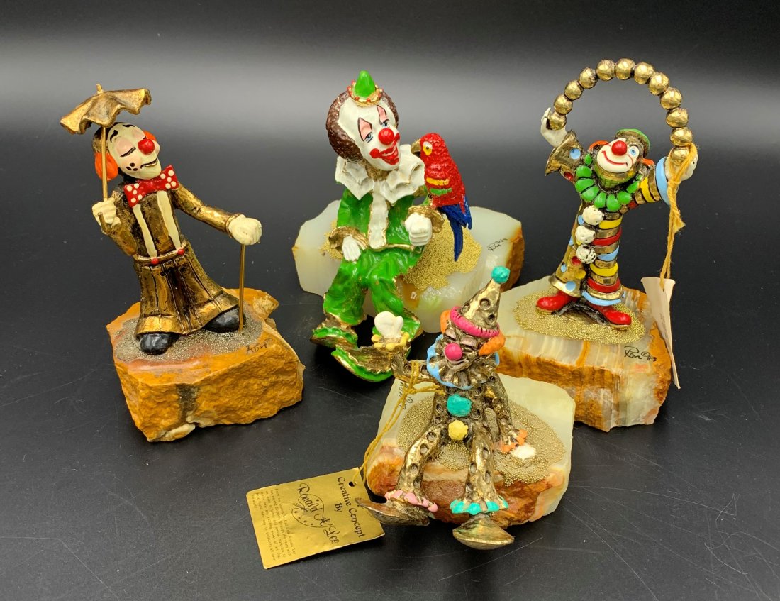 4 Ron Lee Clown Sculptures 24K Gold Plated: 4 Ron Lee Clown Sculptures. Clown holding a parrot measures 5 1/2" tall, 4" wide and 6" deep. Clown with gold balls over his head measures 6 1/2" tall, 4" wide and 3" deep. Clown with umbrella measure