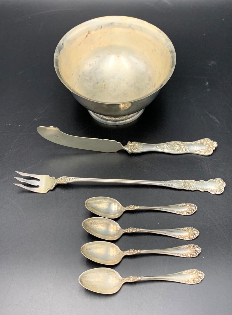 Estate Lot of Sterling Silver 9.2 OZT: Estate Lot of Sterling Silver 9.2 OZT. One small bowl measuring 2 3/4" tall and 5" in diameter. Four 4" baby spoons. One 7" cheese knife. One 8" olive fork. Overall condition is good.