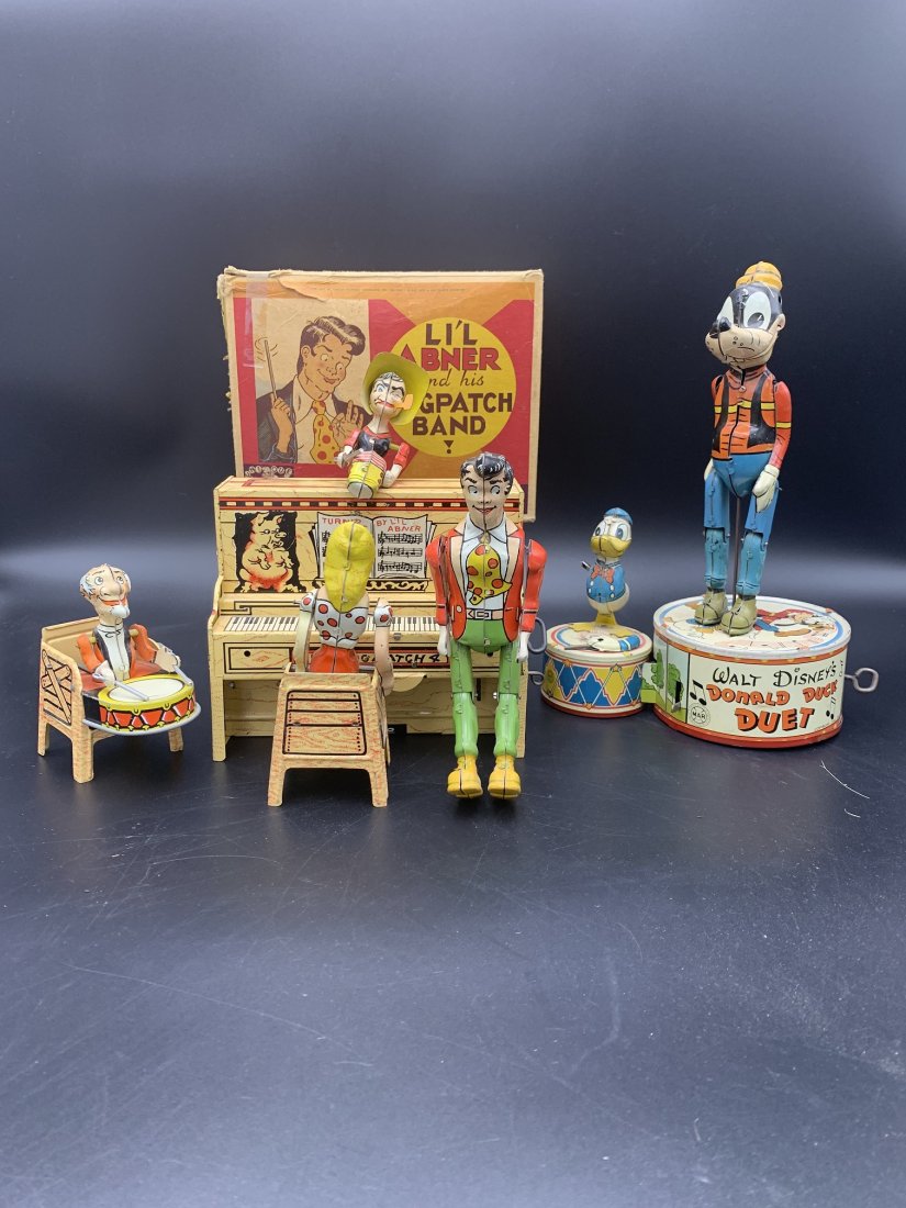 1940 Li'l Abner Dogpatch Band Donald Duck Duet Tin Toys: 1940's Li'l Abner Dogpatch Band & Donald Duck Duet Tin toys. Lithographed Windup Toy in original box. Walt Disney's 1946 Donald Duck Duet Marx Toys. Goofy is missing it's ears and Donald Duck its miss