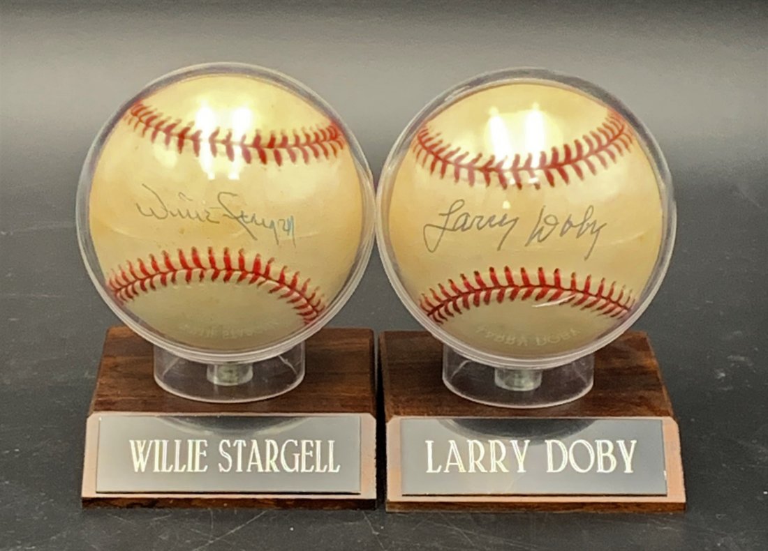 2 Signed Baseballs - Willie Stargel & Larry Doby: 2 Signed Baseballs - Willie Stargel & Larry Doby. Both baseballs are incased in a plastic case on a wood base. Both come with Certificate of Authenticity. All Baseball items in this auction came from 