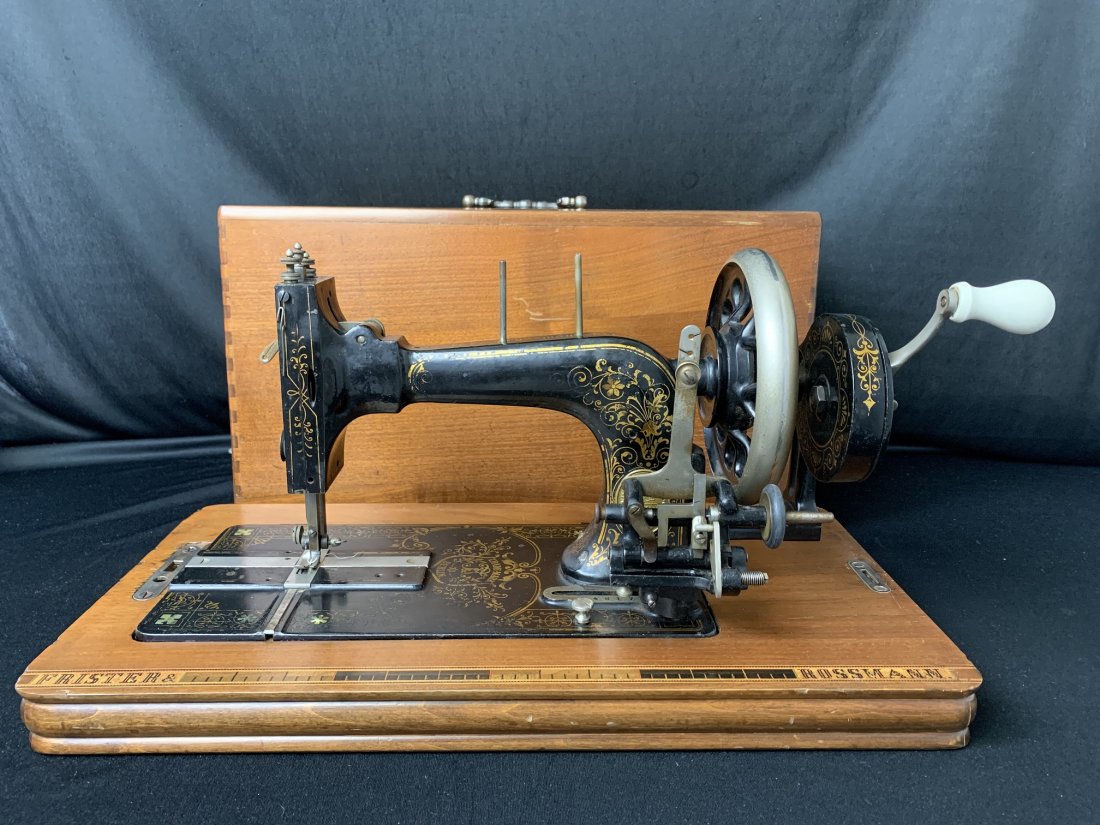 Frister & Rossmann Hand Crank portable Sewing Machine: Antique Frister & Rossmann Hand Crank portable Sewing Machine. Sewing machine come with 11 accessories & wood case with a small compartment to store sewing accessories. Case measure 11 1/2" tall x 19"