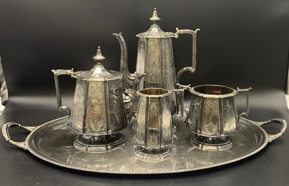 English Aesthetic Movement Silverplated Tea Service: English Aesthetic Movement Silver Plated Tea Service. Teapots, creamer cup & serving tray. Tray measures 25 1/5" wide x 16 3/4 deep, large tea teapot with lid measures 12 1/4 tall, medium sizes teapot