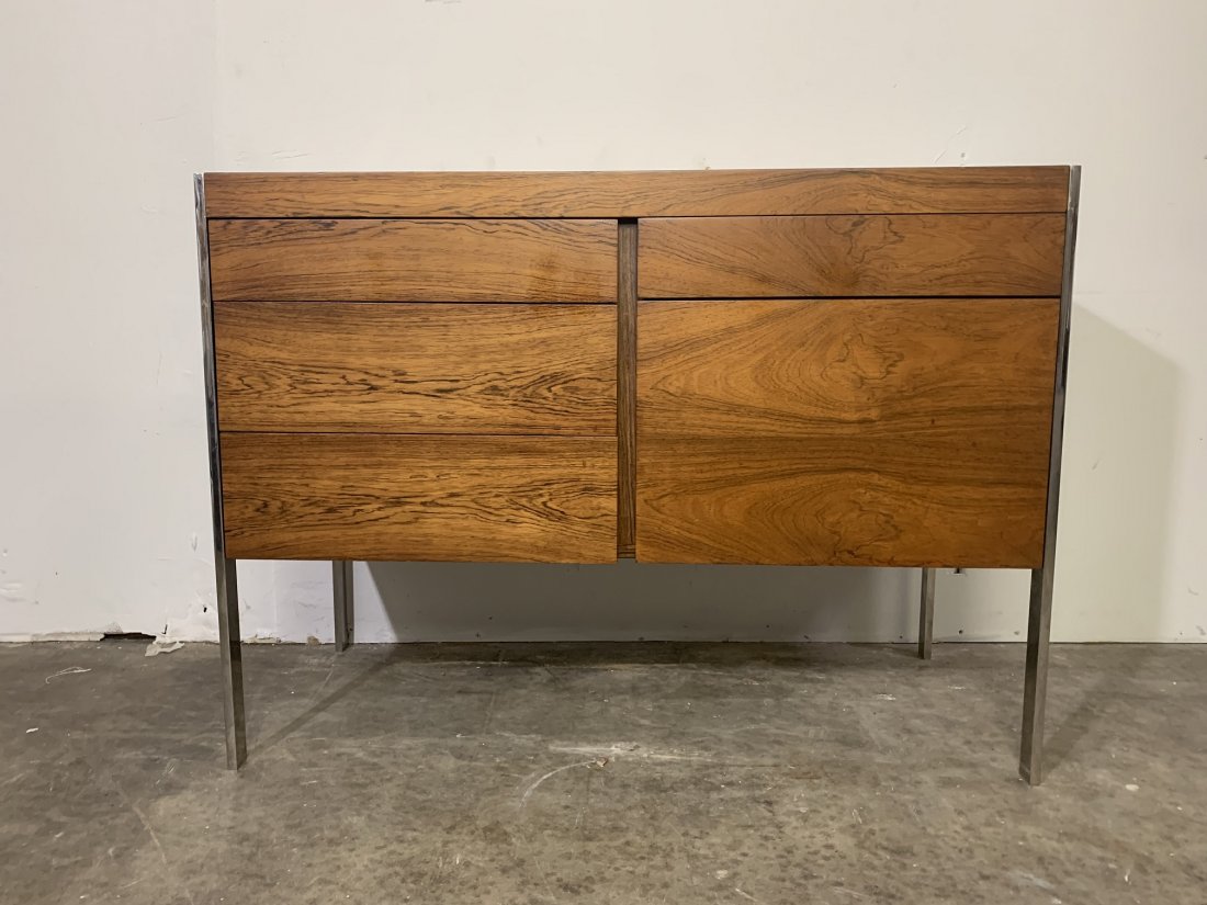 Mid-Century Rosewood Credenza with Chrome Legs: Mid-Century Rosewood Credenza with Chrome Legs. Multi-purpose desk Measures 29" tall x 40 long x 18" deep. Desk has four drawers and one filing, storage compartment. In good condition.