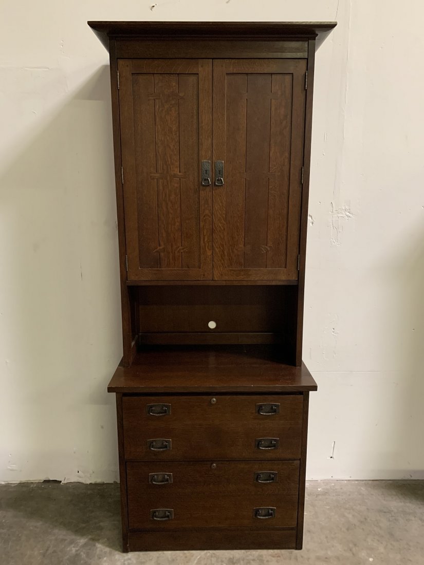 Stickley Arts & Crafts Lateral Filing Cabinet - Hutch: Stickley Arts & Crafts Lateral Filing Cabinet with Hutch. The cabinet measures 82 1/2" tall 32" wide x 19" deep. Cabinet separated into two parts. Large storage space with shields and two drawers. In