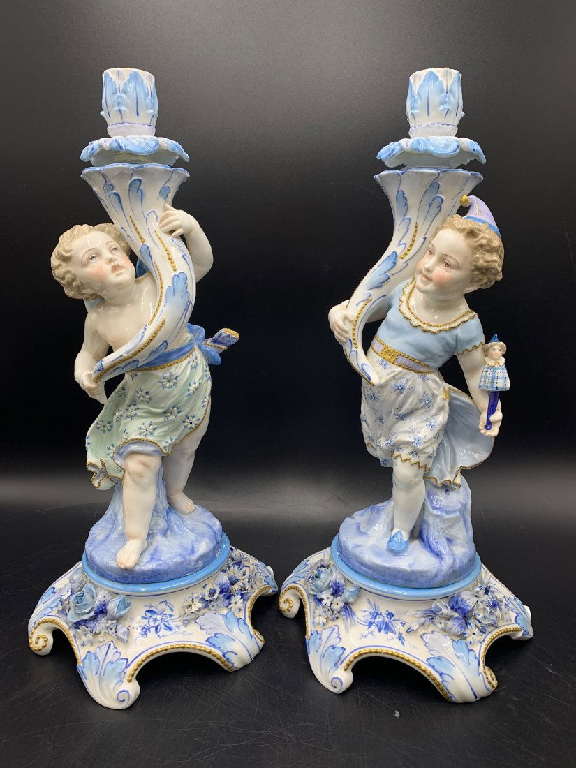 Pair of French Antique Porcelain Figural Candle holders: Pair of French Antique Porcelain Figural Candle holders. Porcelain candle holders measure 15 1/2' tall 7 1/2" wide. 4.5 lbs each. In good condition.