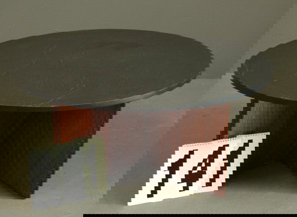 FRANK LLOYD WRIGHT TABLE: SLATE TOP COFFEE TABLE WITH WALNUT CRISS CROSS CARVED WALNUT BASE, DESIGNED AND SIGNED BY FRANK LLOYD WRIGHT FOR HENREDON HERITAGE COLLECTION, ORIGINAL FINISH, 36D X 16H.