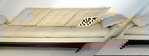 ADRIAN PEARSALL SOFA: LONG & SLEEK ADRIAN PEARSALL FOR CRAFT ASSOCIATES WHITE BENCH SEAT SOFA WITH SOLID WALNUT TRIM ORIGINAL TUFTED FABRIC UPHOLSTERY, 104L.