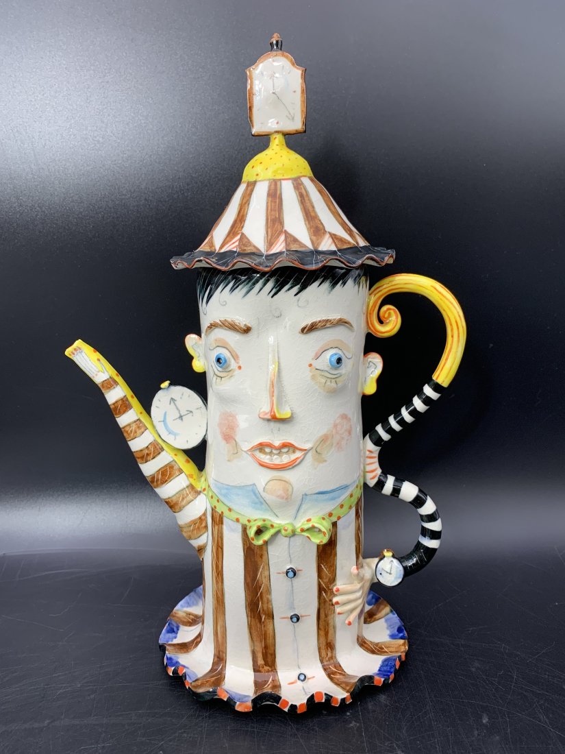 Irina Zaytceva Whimsical Porcelain Figural Teapot: Irina Zaytceva Whimsical Porcelain Figural Teapot. Initialed by the artist on the back. The whimsical porcelain teapot with lid measures 12" tall x 7 1/2" wide x 4 1/2" depth. Weight: 1 lbs. 10oz. The