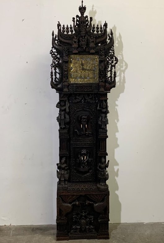 Southeast Asian Antique Heavily Carved Tall Case Clock: Southeast Asian Antique Heavily Carved Tall Case Clock. The tall case clock measures 95" tall 26" wide x 14" depth. Please refer to all pictures. The grandfather clock appears to have some cosmetic re