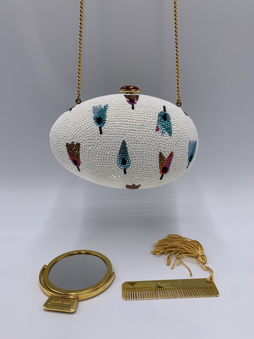 Judith Leiber Swarovski Crystal "Spring Tulips" Clutch: Judith Leiber Swarovski Crystal "Spring Tulips" Clutch. The egg shape clutch comes with mirror & comb. Gold leather lining & beautiful Swarovski crystal flower design. Snake chain metallic gold strap