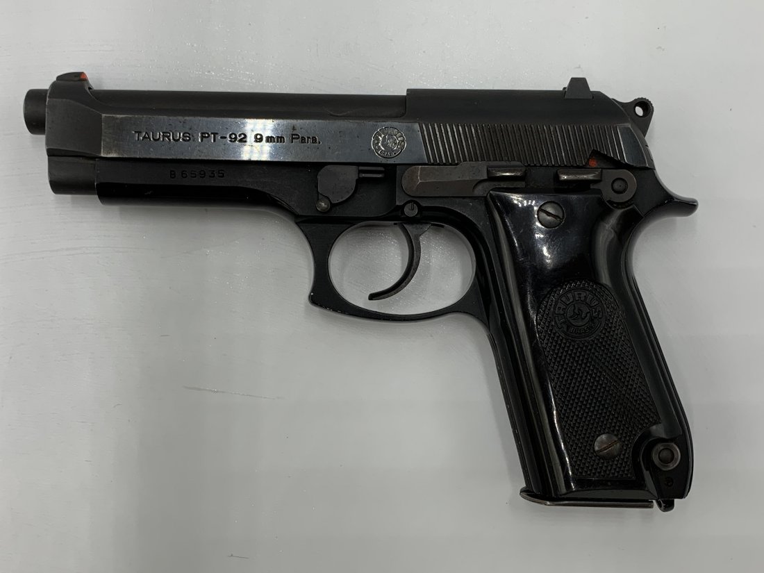 Taurus Model PT-92 9mm Semi-Auto Pistol: Taurus Model PT-92 9mm Semi-Auto Pistol. Black Model: B65935. Measurements: 5 1/2" tall x 8 1/2" length. Weight: 2 Lbs. 2 Oz. In good condition. $65 will be added to all firearms sold online for trans